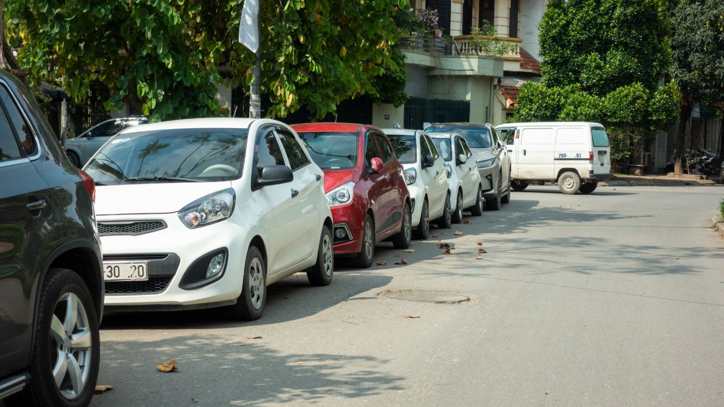 Cars Parked In A Row Along The Street 