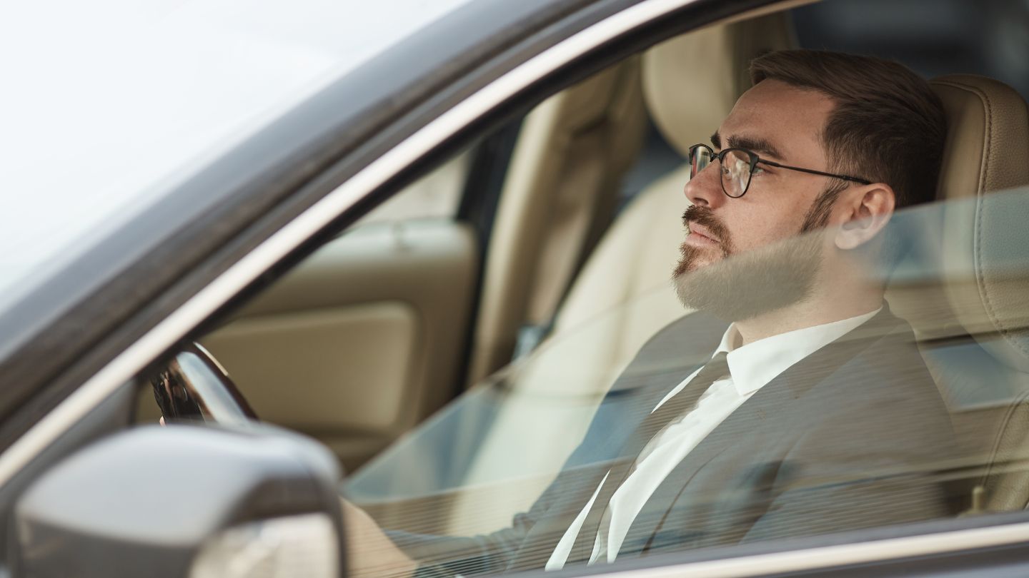 Man Sitting Calmly in Car