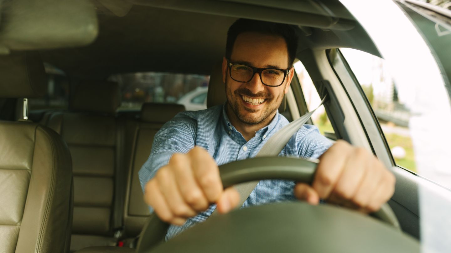 Man Confidently Driving A Car 